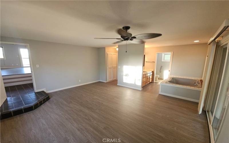 Master Bedroom with walk-in closet, two person tub, and private shower/toilet area