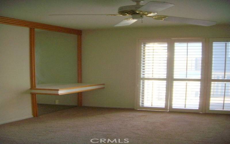 Master bedroom with sliding door to patio deck area.