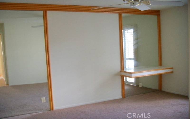 Another view of the master bedroom. Carpet and shutters.