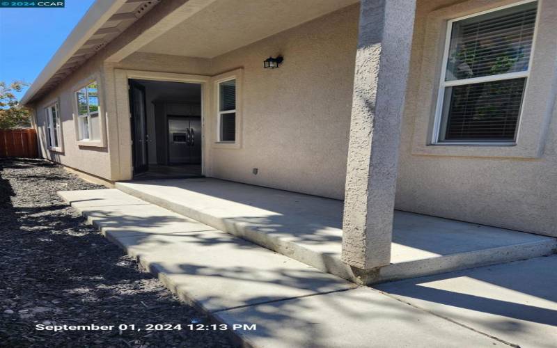 Off of kitchen for easy access to backyard