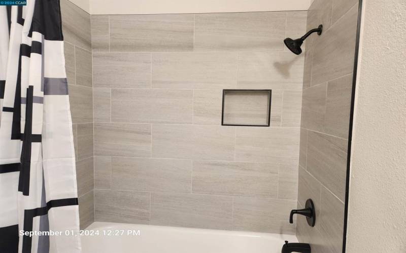 Beautiful artisan tiled Bath/Shower combo