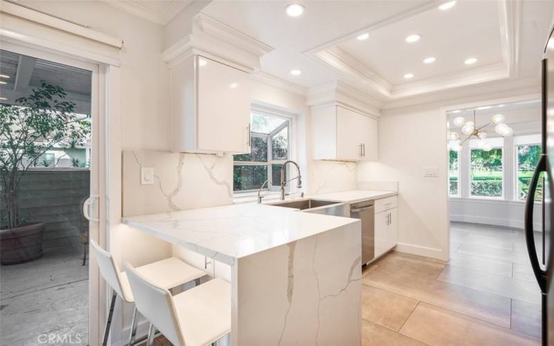 Recently remodeled kitchen with quartz countertops and newer cabinets.