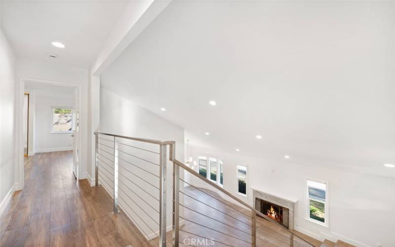 Upstairs landing leading to primary bedroom.