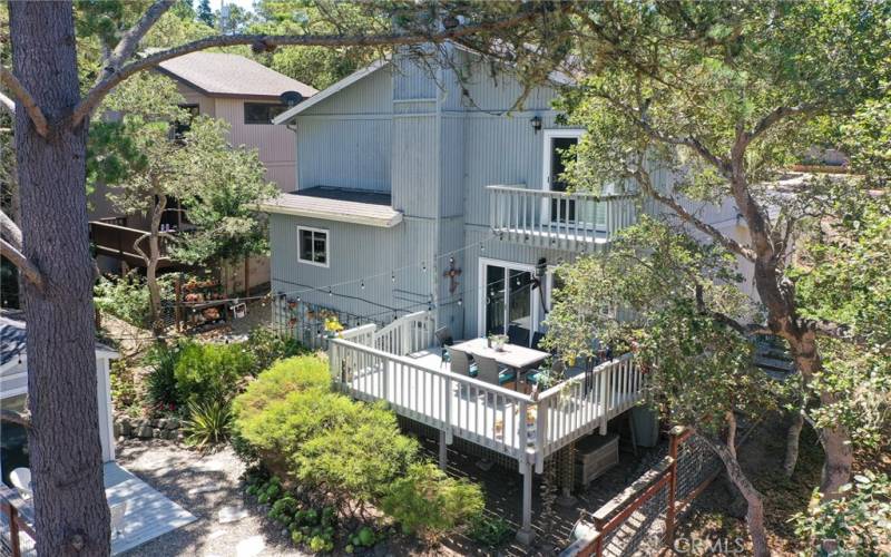 Great drone shot of large deck with furniture and barbecue included. 2nd floor deck is off of Master bedroom.