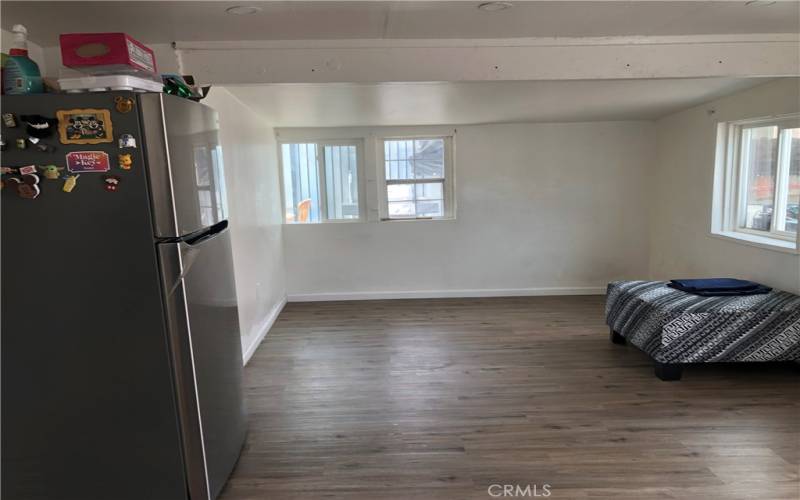 Living Room laminate flooring throughout back house