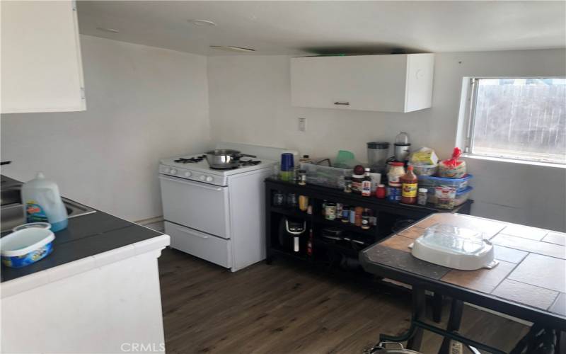 Wide view kitchen with eating nook back house