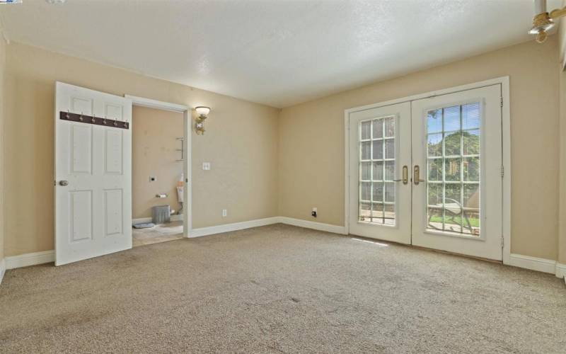 In-law quarters with a private front door entrance and French doors leading to the backyard.