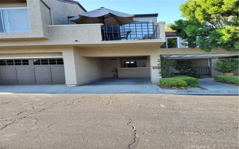 Front of property one car garage and carport