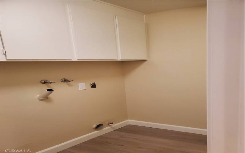 Laundry room between the garage and the kitchen.