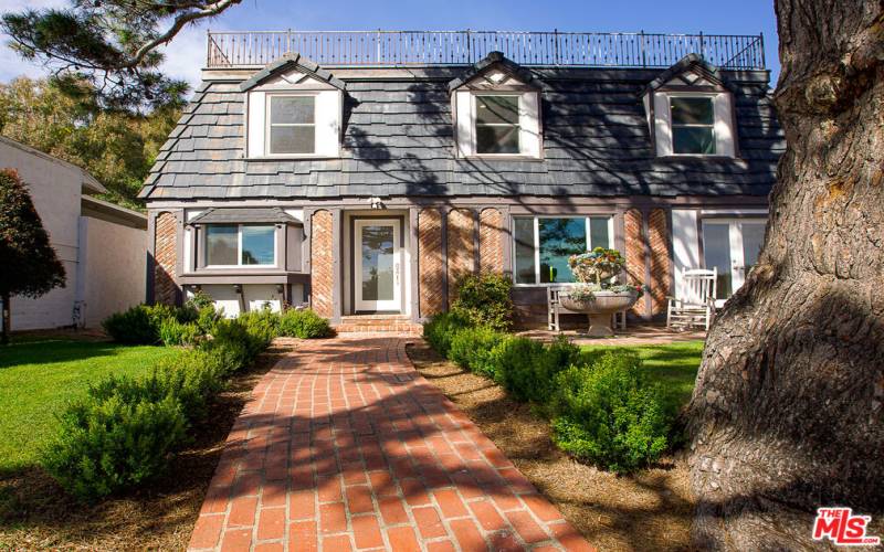 Front of home and gated yard