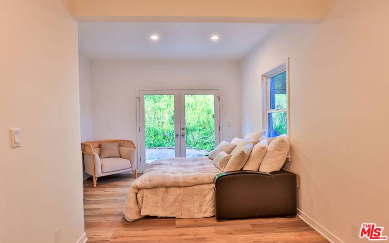 Downstairs Bedroom #2. French Doors to back patio