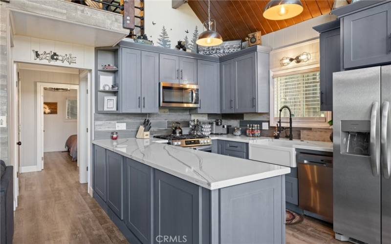 Upgraded kitchen with gorgeous quartz counters and stainless appliances