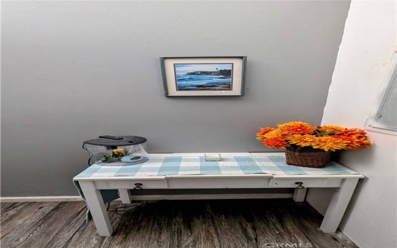 Hallway view of flowers/fish tank