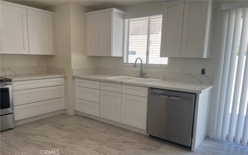 Brand new kitchen with new appliances, floors, paint and cabinetry.