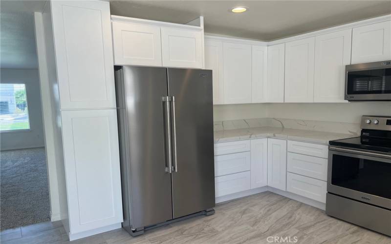 There's plenty of storage and counterspace in this grey and white kitchen.