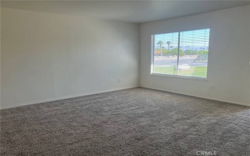 The 4th bedroom faces the side yard and has a ceiling fan and large closet.