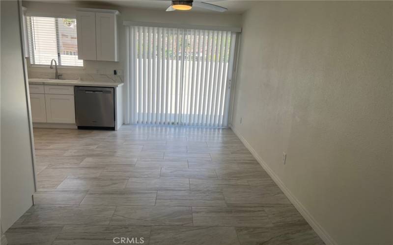 View from living room to the dining area and kitchen.