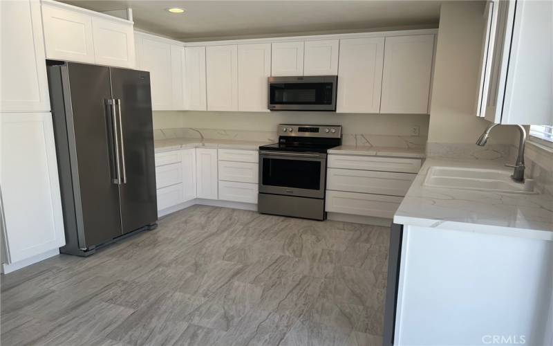 New stainless double door refrigerator and a nice pantry cabinet are just two of the great features of this home.