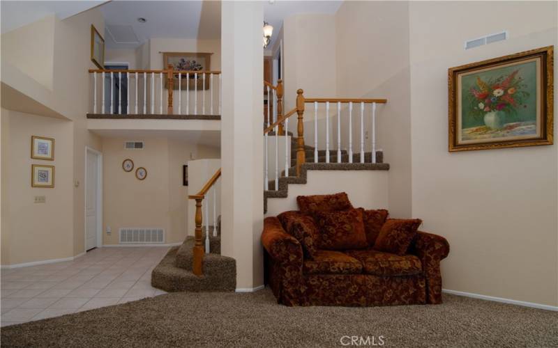 Living room looking to staircase