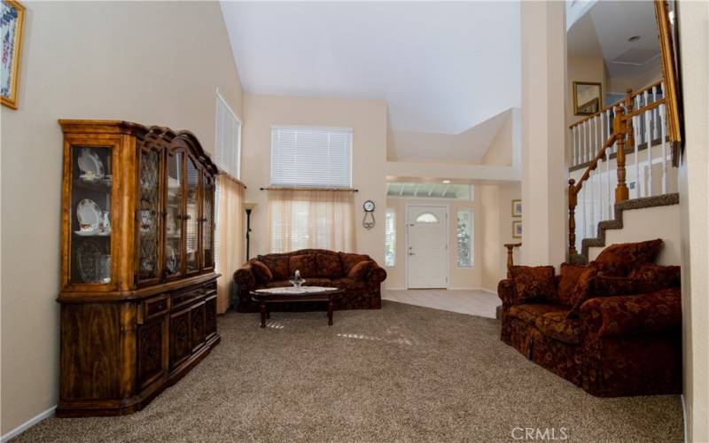 Dining area looking to living area and  front entry