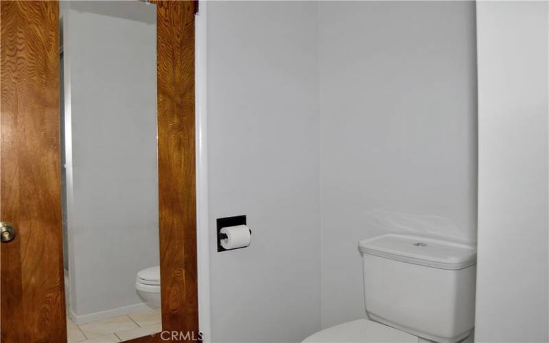 Beautifully upgraded 2nd bath with furniture-style vanity, rain glass shower enclosure, linen closet, tile flooring, and modern fixtures and lighting to make it shine