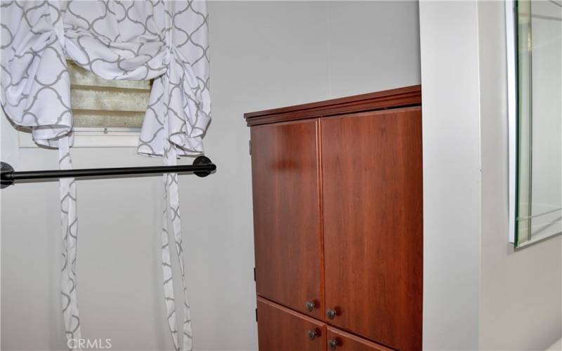 Beautifully upgraded 2nd bath with furniture-style vanity, rain glass shower enclosure, linen closet, tile flooring, and modern fixtures and lighting to make it shine