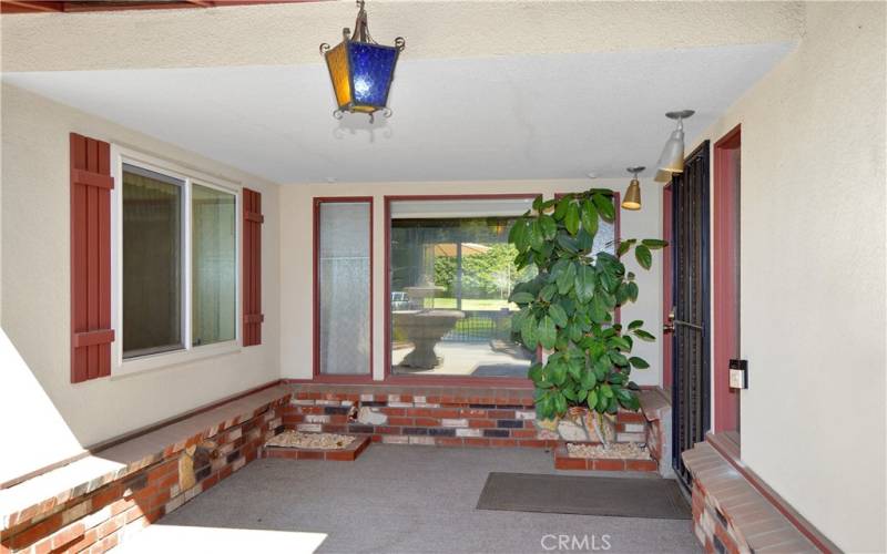 Covered porch with windows into the living and dining rooms