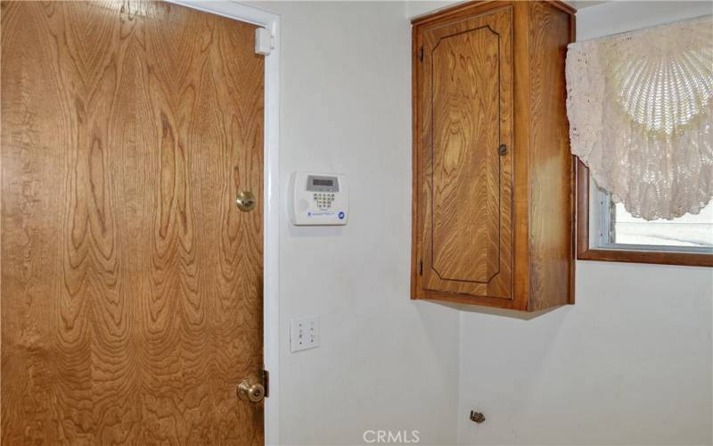 Good-sized laundry room with room for a sink, handy cabinets, and accessible from the garage, kitchen, and main suite bath.