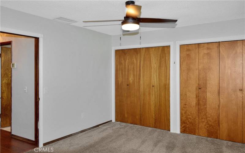 The 3rd spacious bedroom is at the front and has dual closets, newer carpet, and a ceiling fan to cap it off