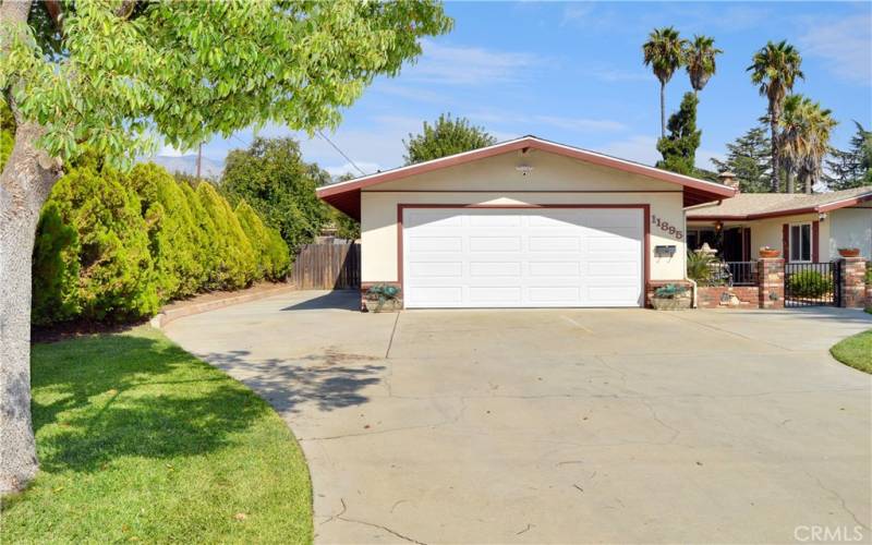 Plenty of space alongside the garage to park an RV with an expansive driveway for multiple cars as well.