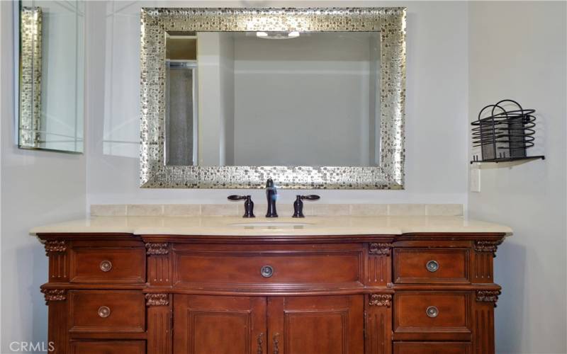 Beautifully upgraded 2nd bath with furniture-style vanity, rain glass shower enclosure, linen closet, tile flooring, and modern fixtures and lighting to make it shine