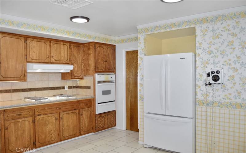 Behind the pocket door in the corner, there's a laundry room and the entry to the garage