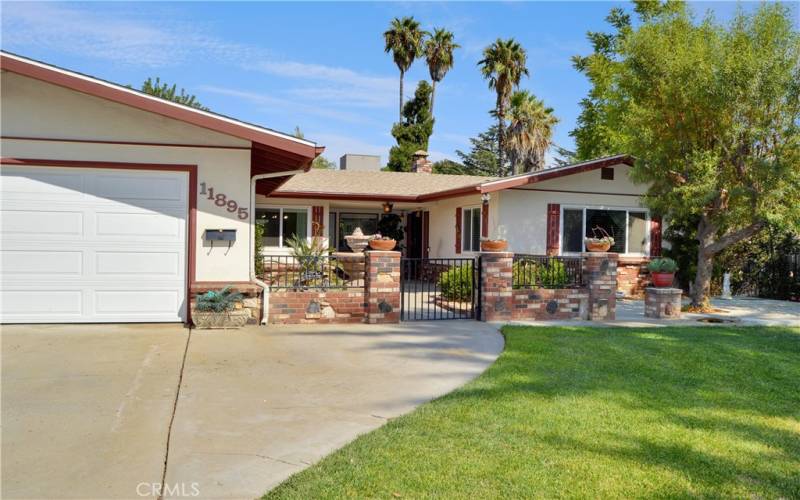 Front courtyard and an open patio off to the side provide great spaces to relax and watch the sunset while sipping your favorite drink