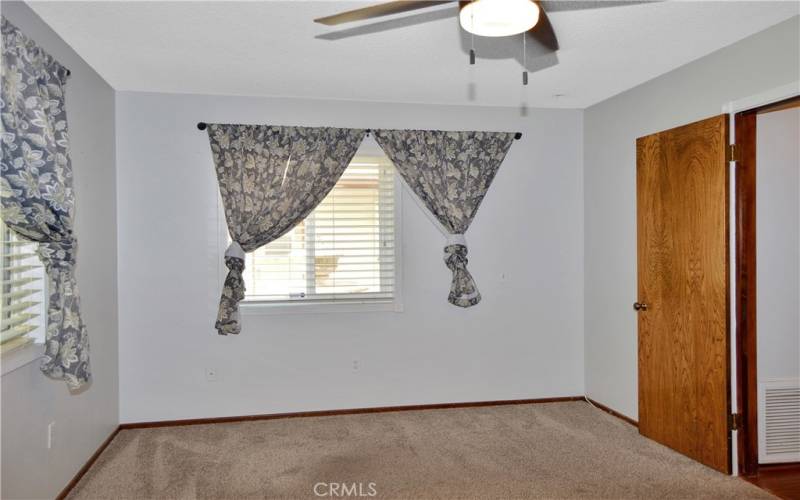 The 3rd spacious bedroom is at the front and has dual closets, newer carpet, and a ceiling fan to cap it off