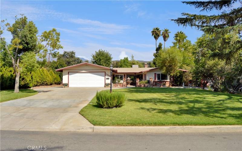 Beautiful, mature landscaping creates a private, welcoming space