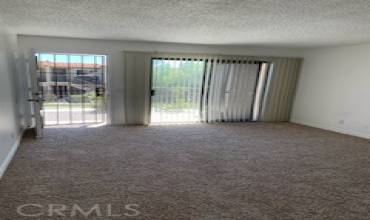 Living room looking out to upstairs deck.