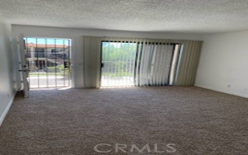 Living room looking out to upstairs deck.