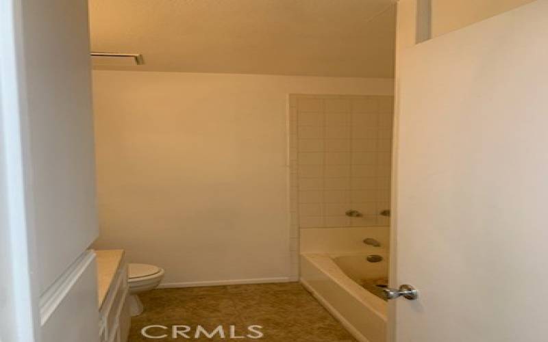 Hall bathroom with tub.