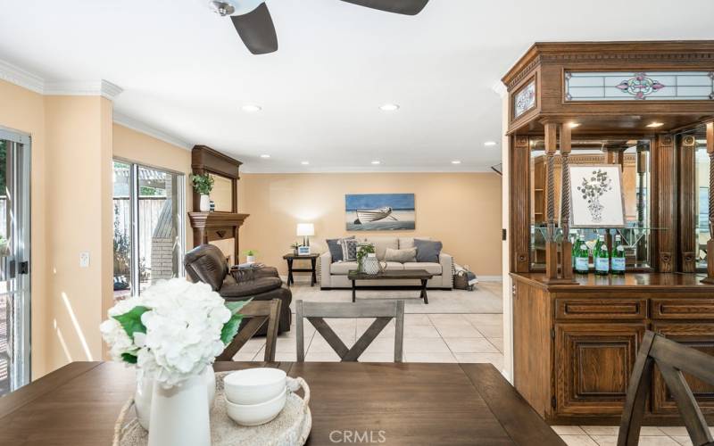 Spacious and open-concept living area with a wet bar and vaulted ceilings