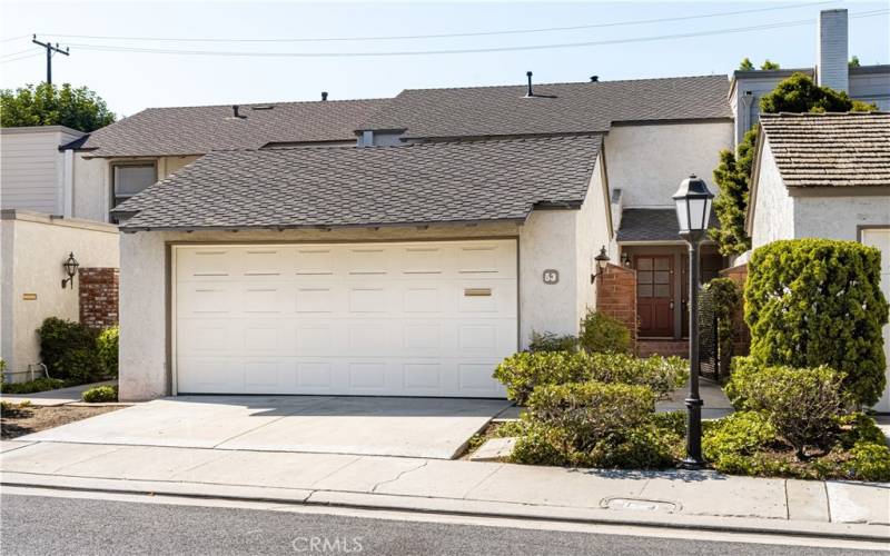 Attached two-car garage with ample driveway parking