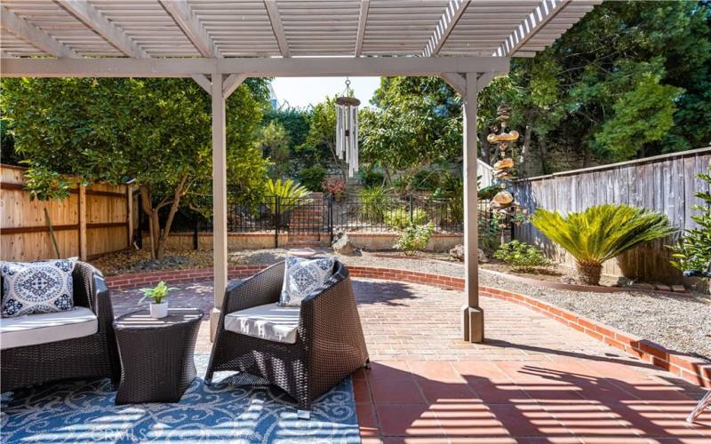 Outdoor oasis awaits: Relax and unwind under the covered patio