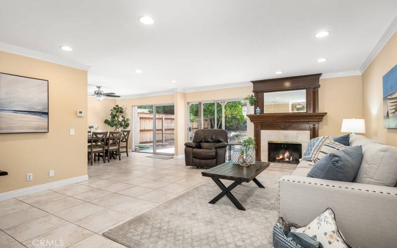 Spacious and inviting living room with a fireplace and ample natural light