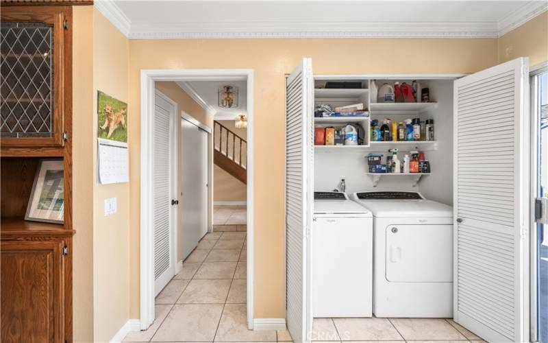 Ample storage space with built-in shelving and a wet bar