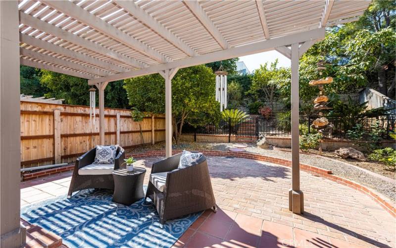 Outdoor oasis awaits: Relax and unwind under the covered patio