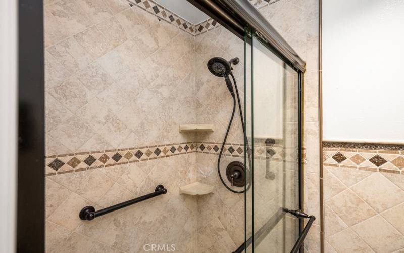 Spa-like shower with dual showerheads and grab bars