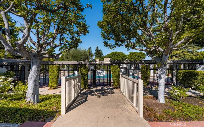 Inviting gated community with mature landscaping and a private entrance