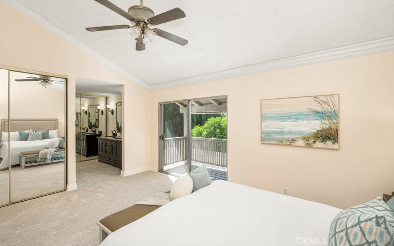 Spa-like primary bedroom with a king-size bed and sliding doors to a private patio