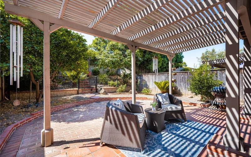 Outdoor oasis awaits: Relax and unwind under the covered patio