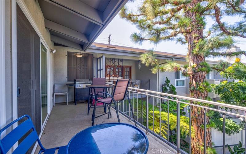 Another view of the balcony where one can enjoy the ocean breezes while viewing the pool, spa and professionally landscaped grounds!