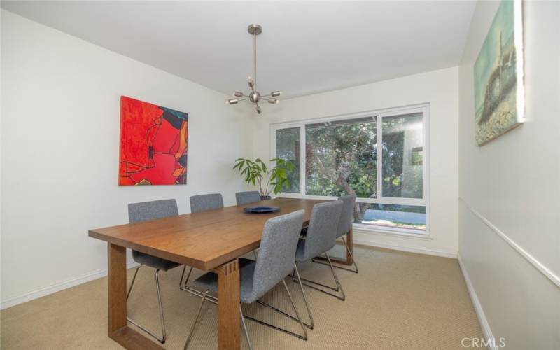 Separate formal dining room, wall to wall carpets throughout: dining room table and chairs as well as artwork included in lease